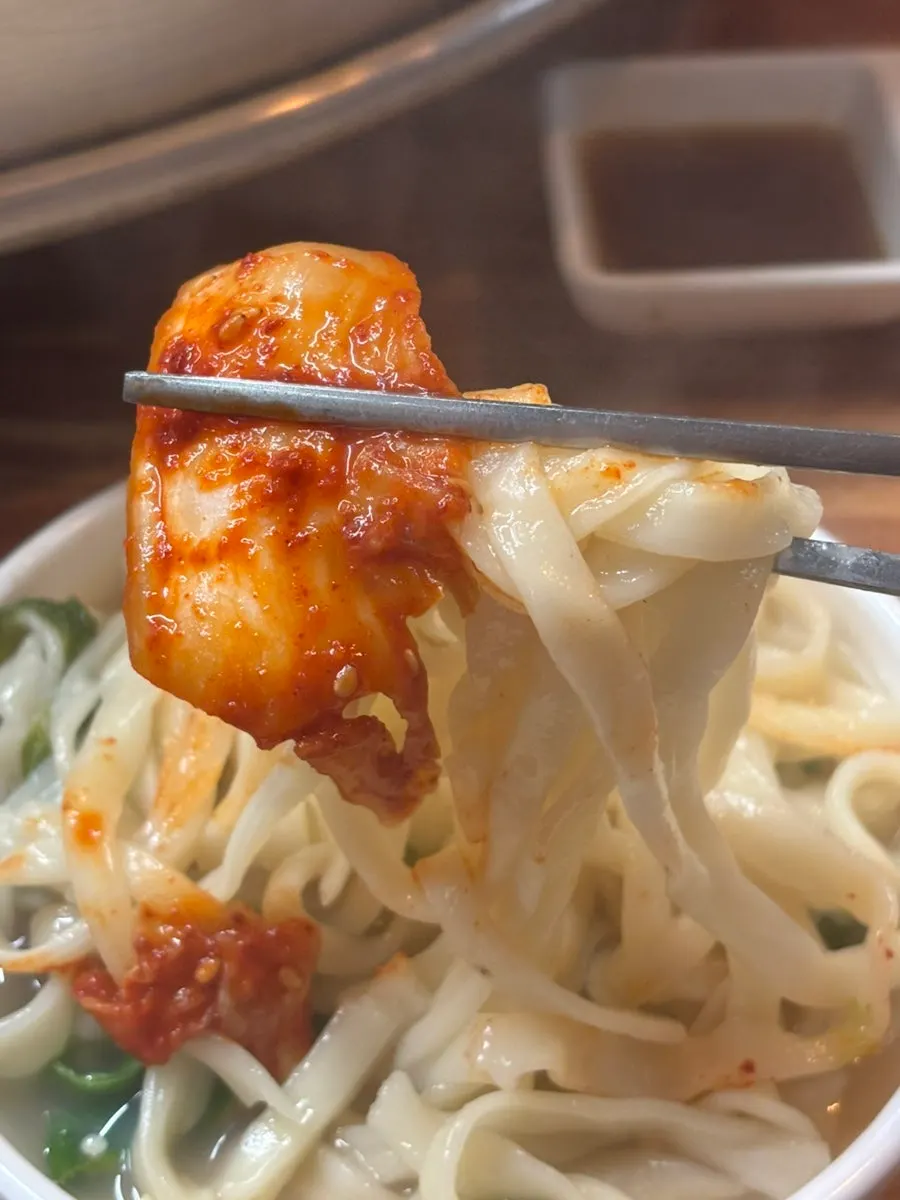 Kalguksu noodles boiled in the clam broth