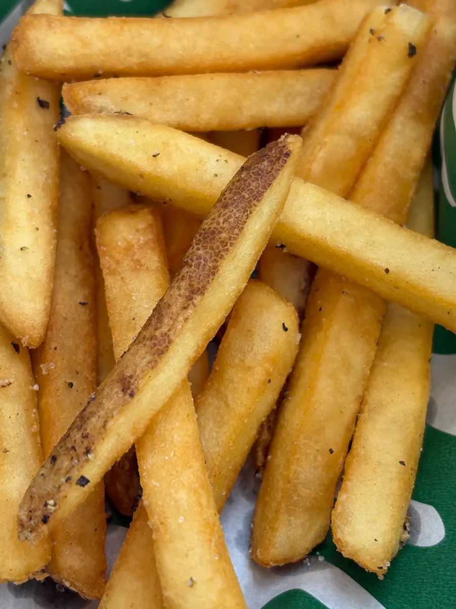 Fries sprinkled with salt and pepper