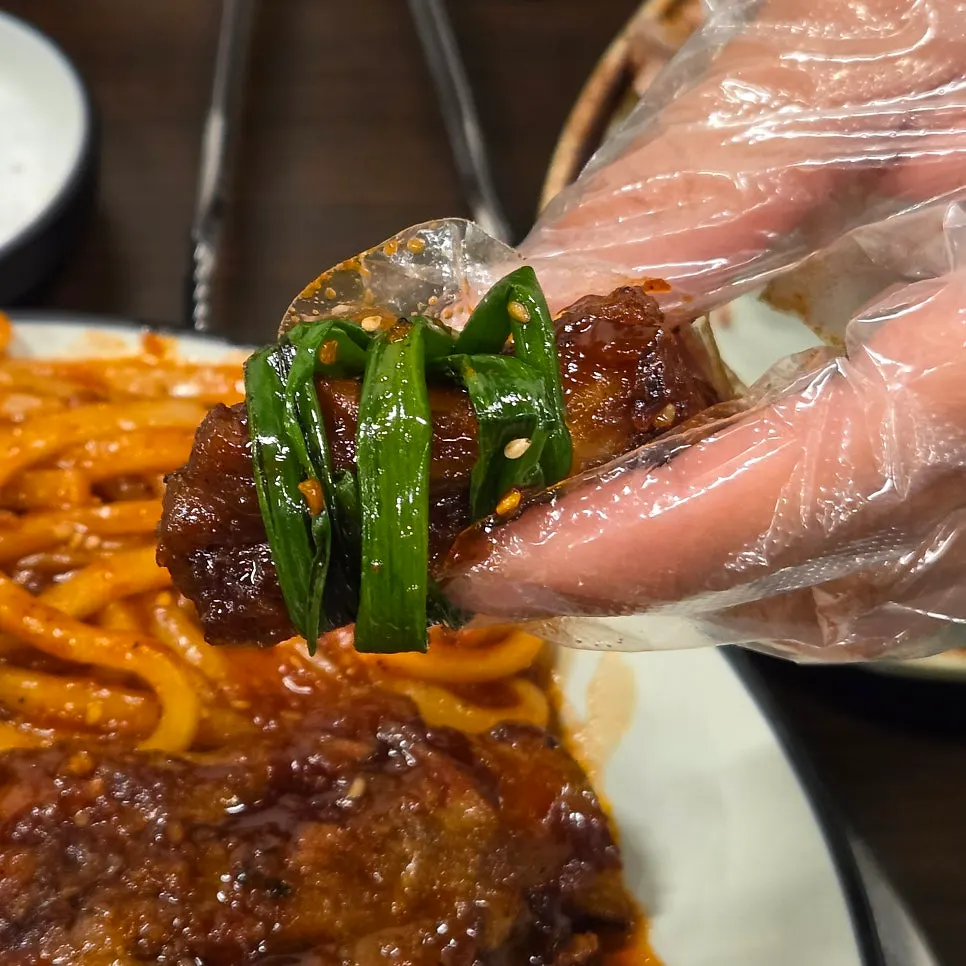 Meat pulled off the bone with shredded green onion
