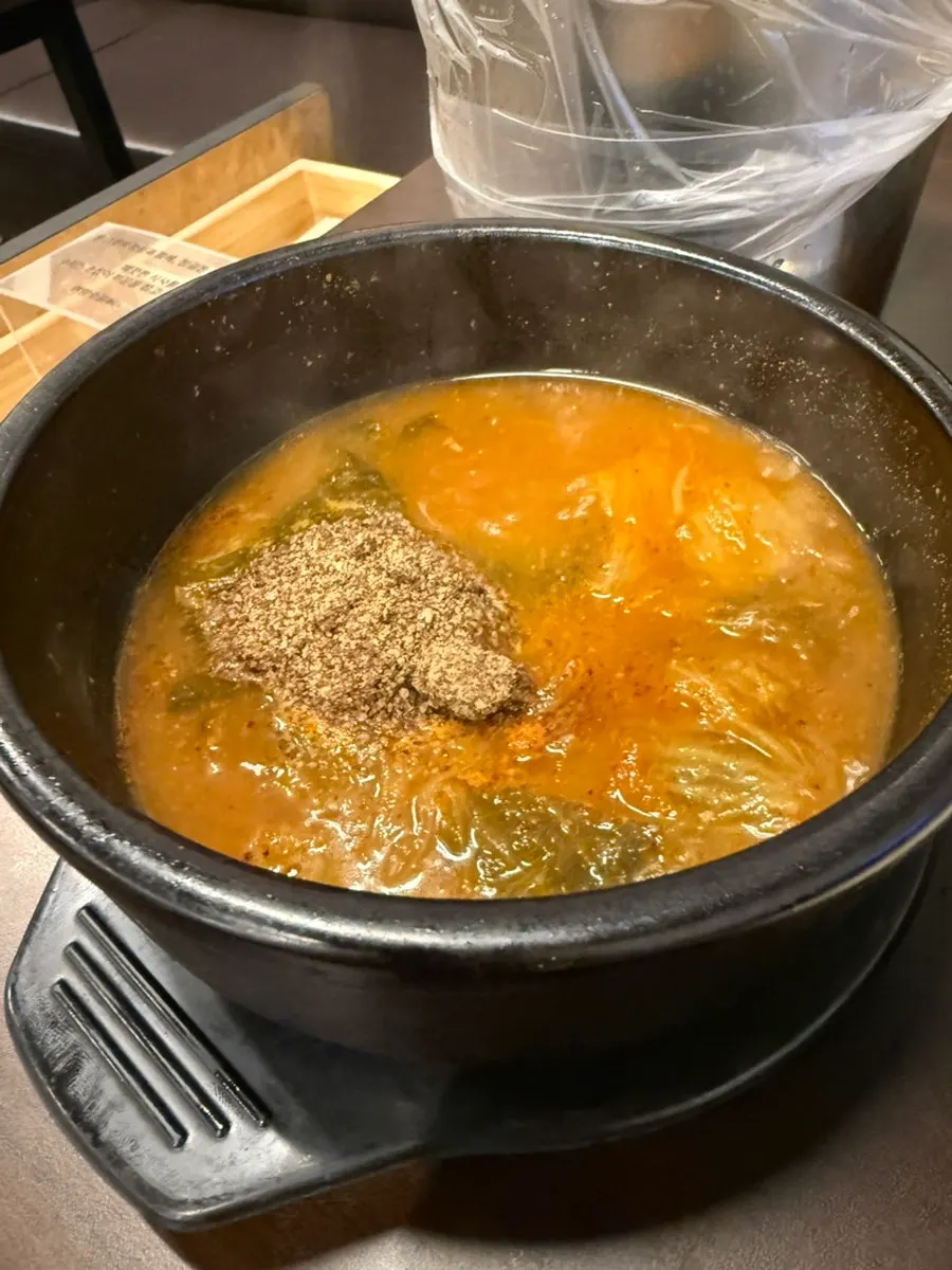 Complimentary sample cup of gamjatang broth