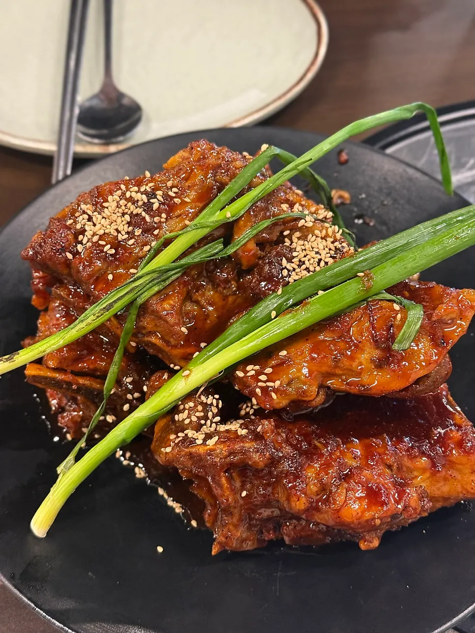 Close-up of the glossy red-sauced pork bone grill