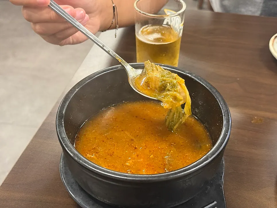 Complimentary gamjatang broth served with the pork bone grill order