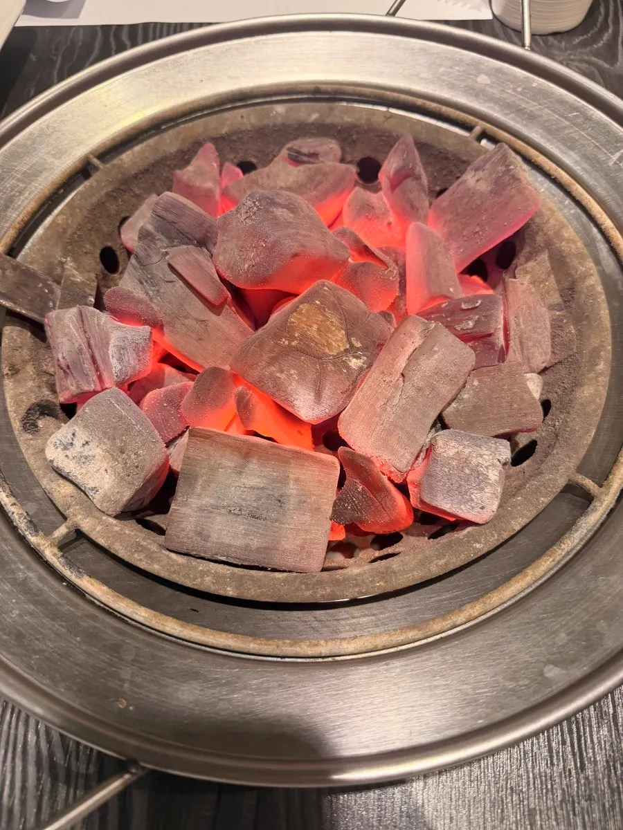 Hanwoo grilling over charcoal