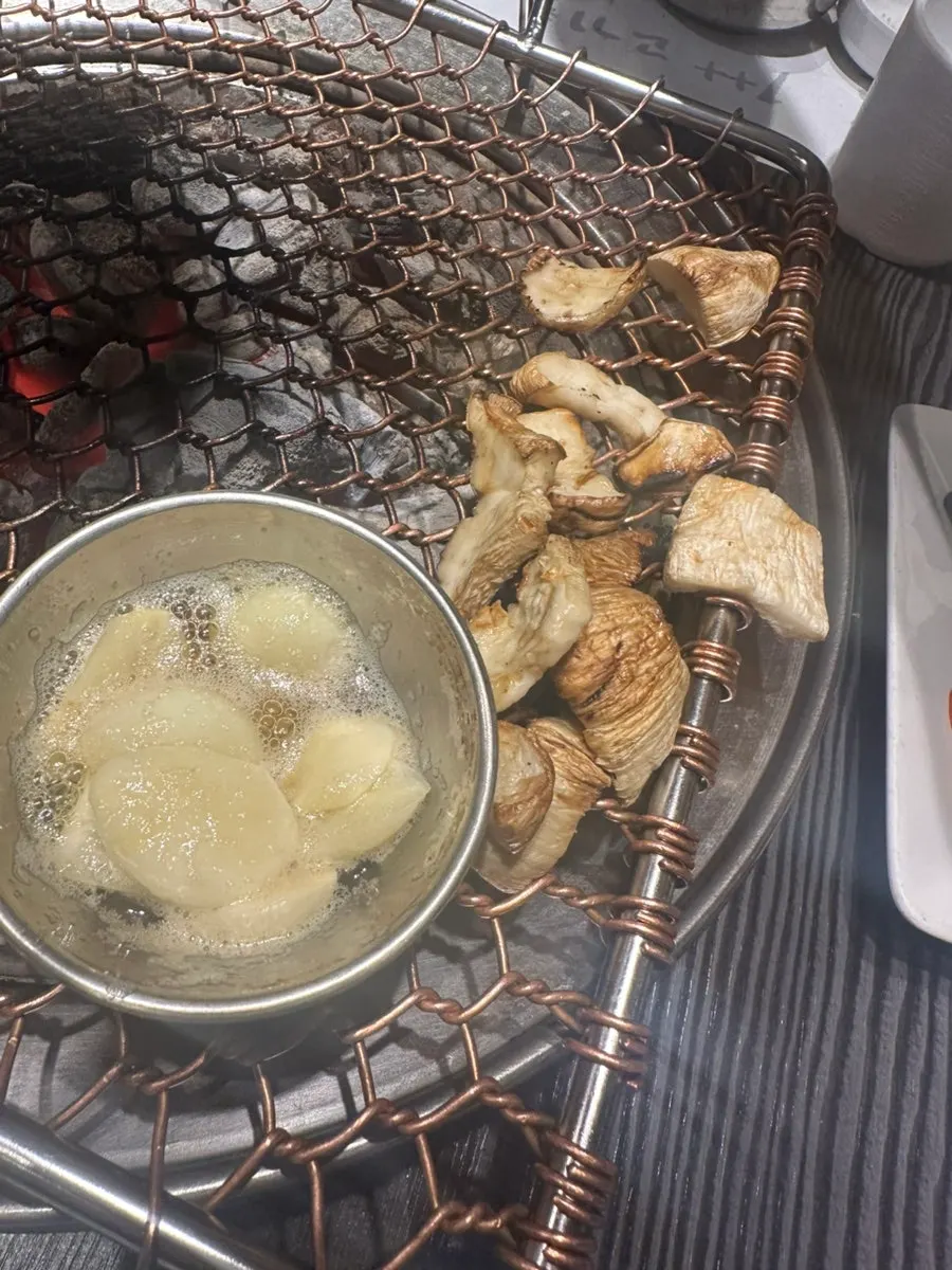 Garlic and sesame oil grilled together on the charcoal