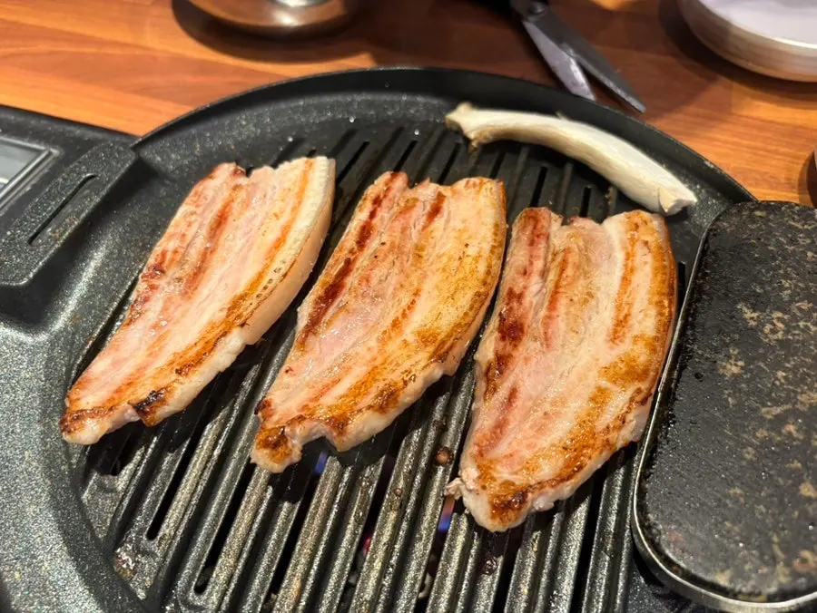 Pork belly placed on the grill
