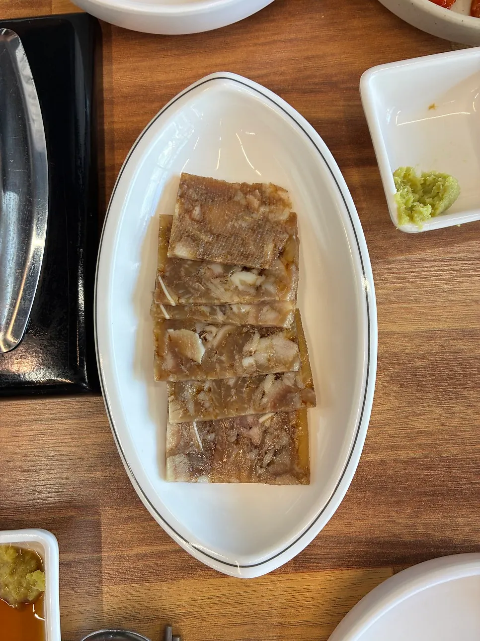 Basic banchan: silkworm pupae, cabbage salad, and baechu kimchi