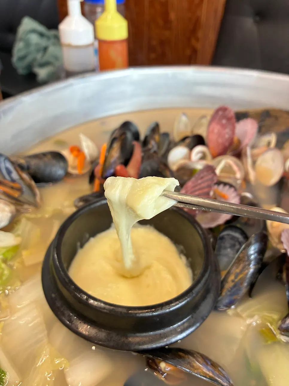 Clam topped with stretchy melted cheese