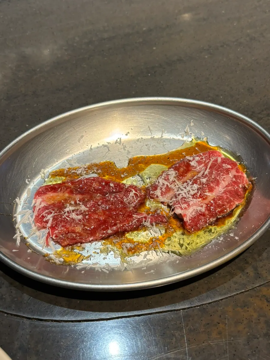 Chimasal beef tartare topped with truffle oil and cheese