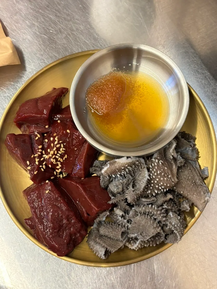 A plate of raw liver and tripe prepared by staff