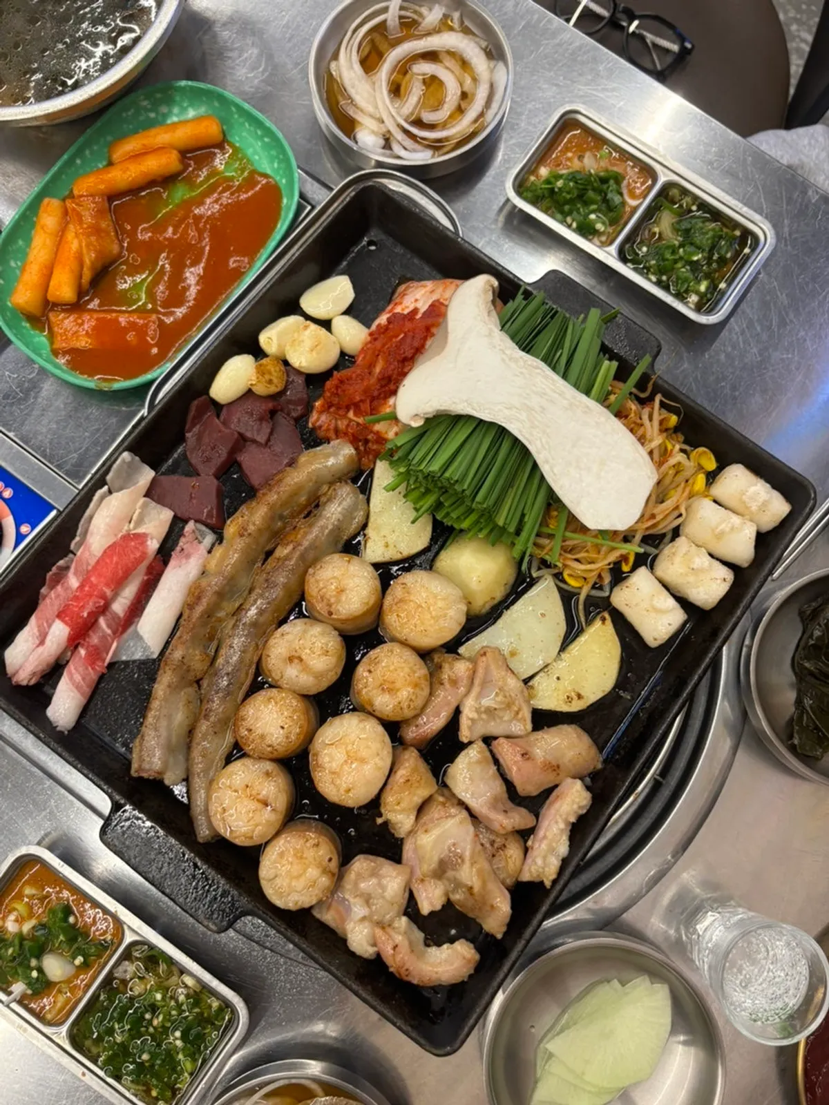 The Uhwa combo platter piled with gopchang and vegetables