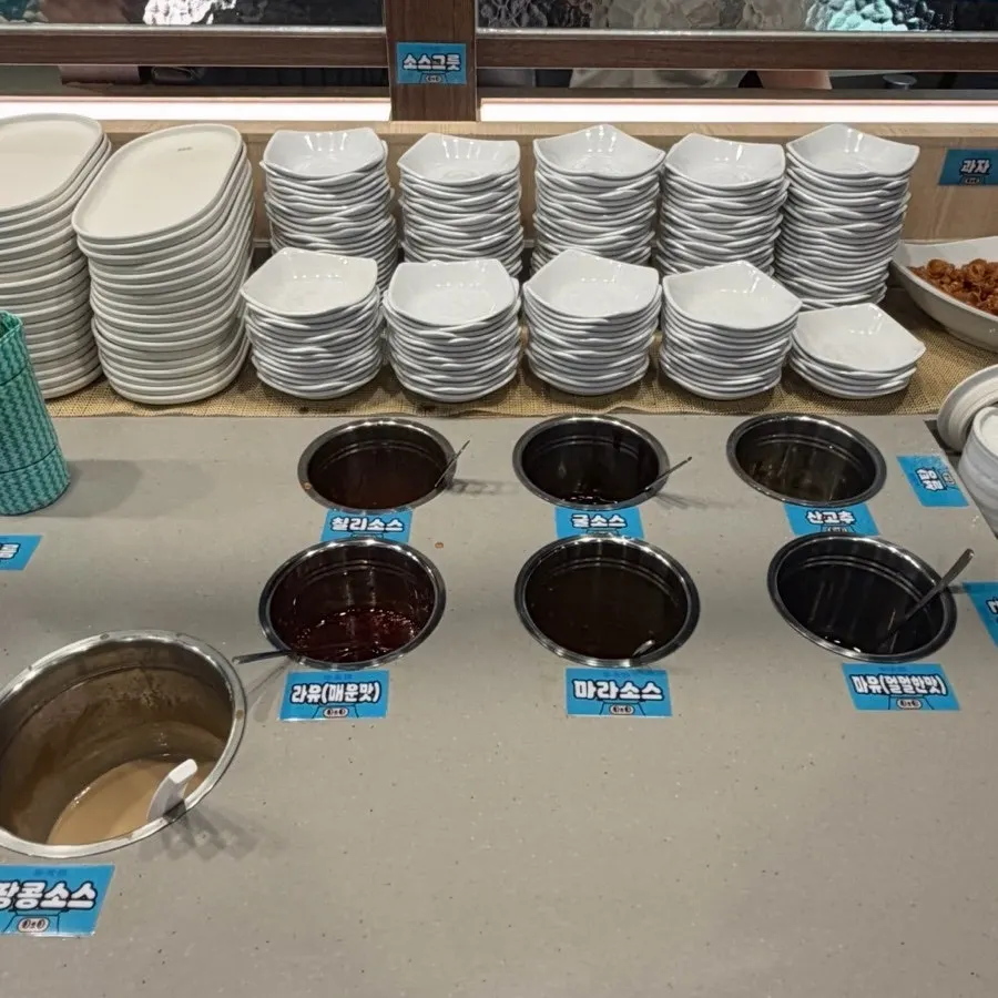 Self-serve bar with rice, rice paper, and sauces
