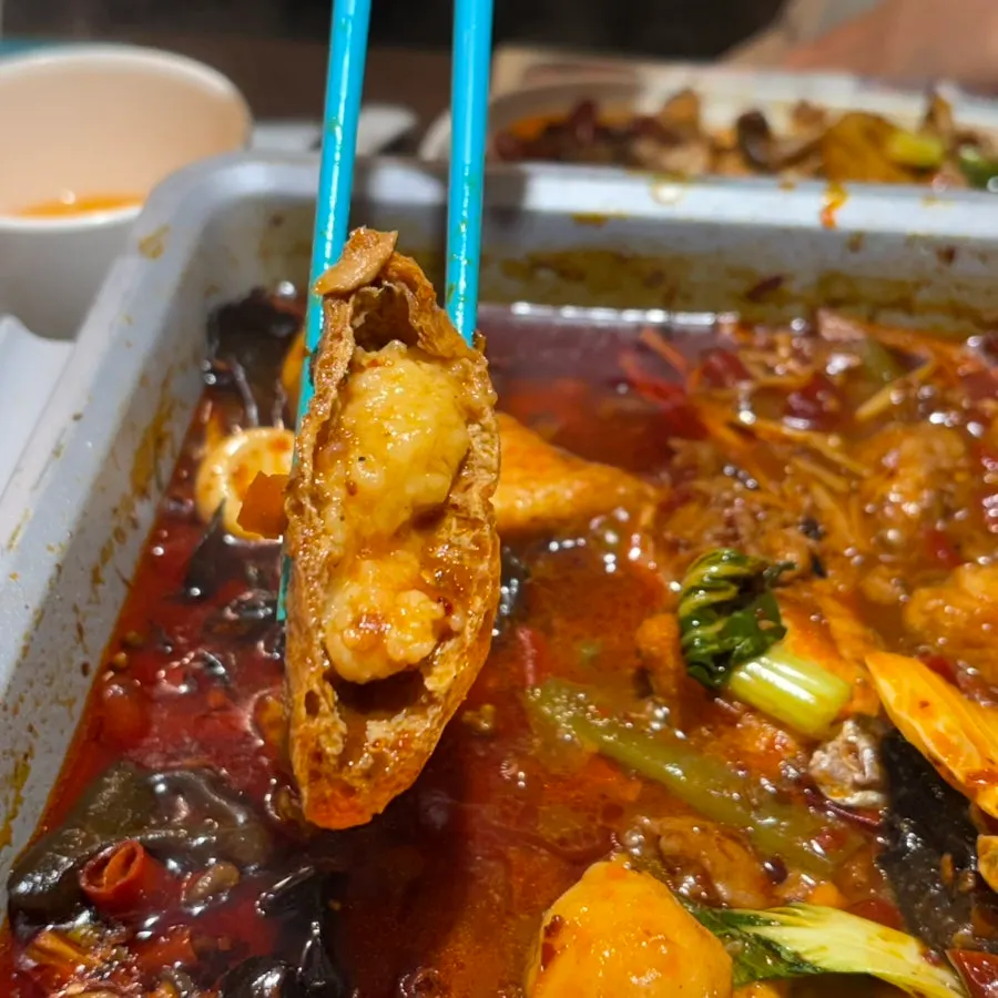 Shrimp balls cooked inside fried tofu