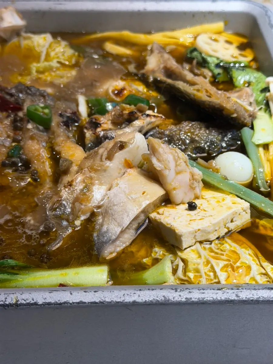 Mushrooms and tofu cooked in the broth