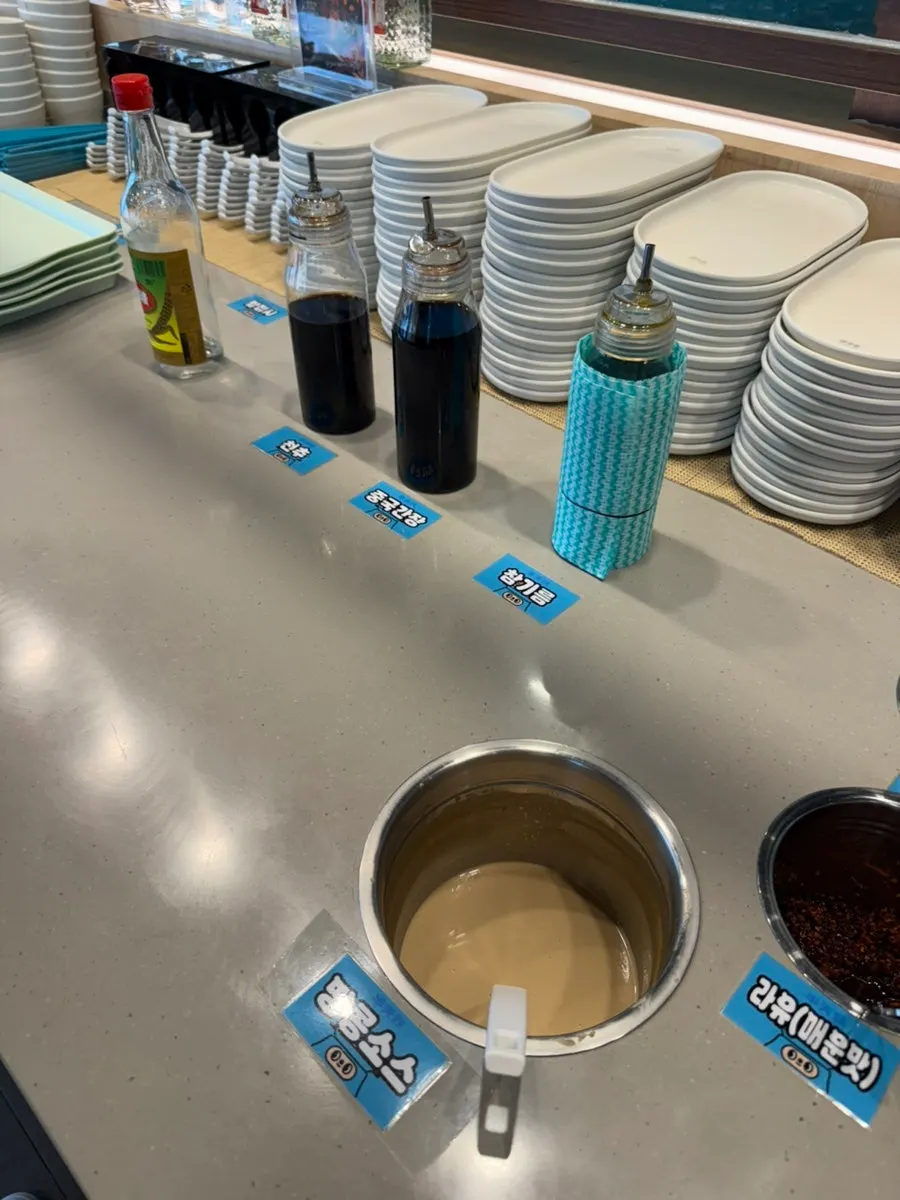 Self sauce bar with chili sauce, mala sauce, and more
