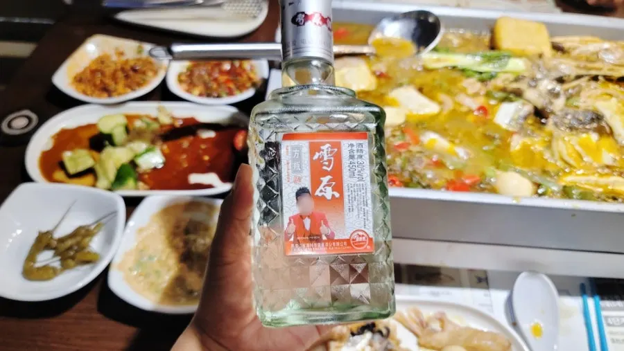 Kaoyu table spread with Saero soju and Chinese liquor Xueyuan