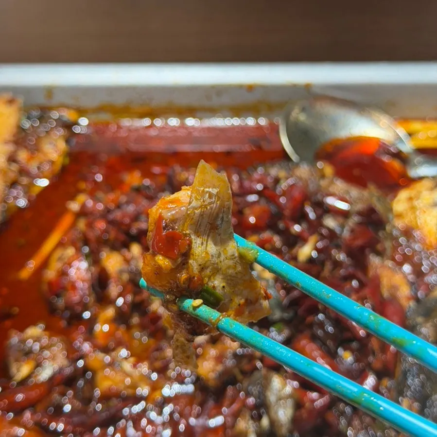 Kaoyu fish piece topped with chili