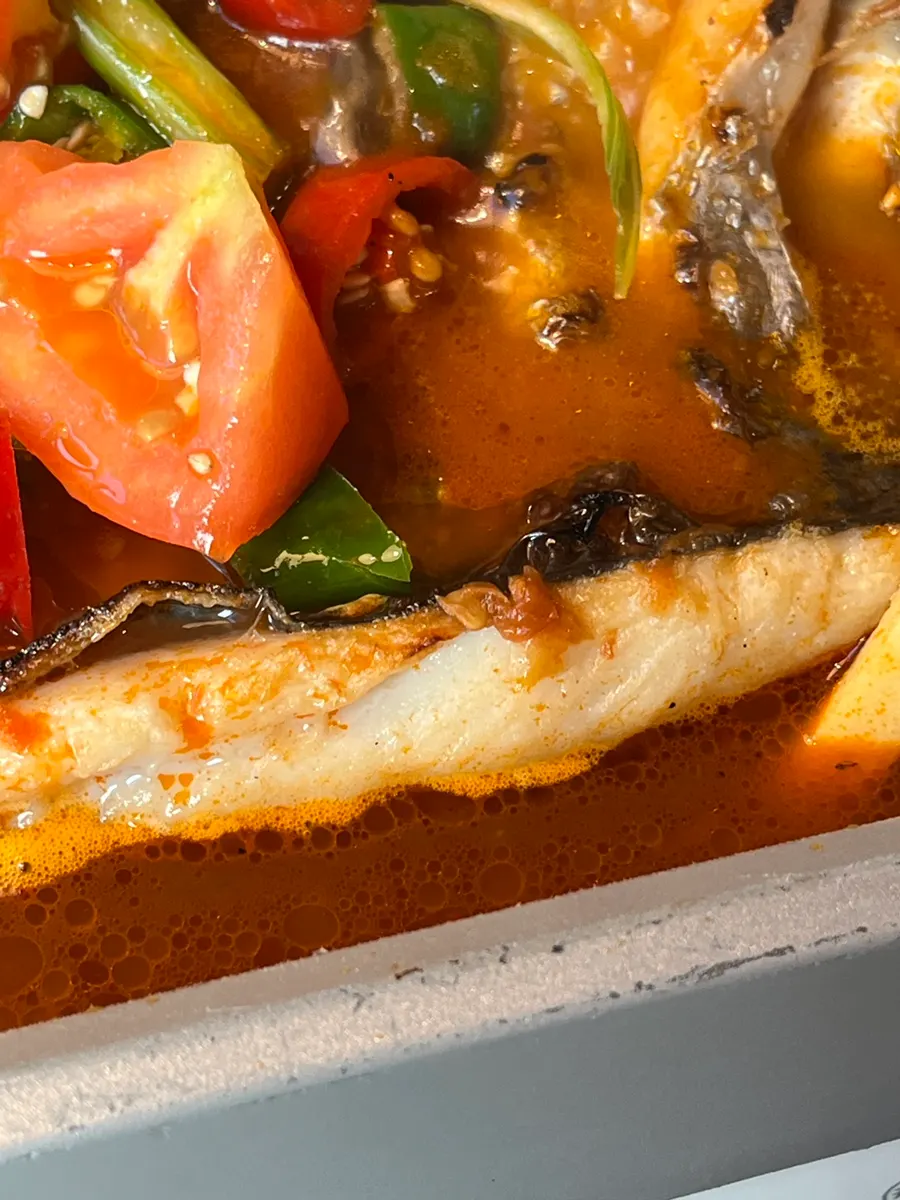 Thick fish meat visible in the tomato kaoyu
