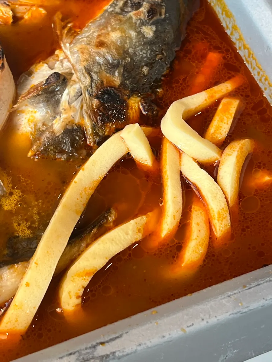 Egg noodles added into the tomato broth