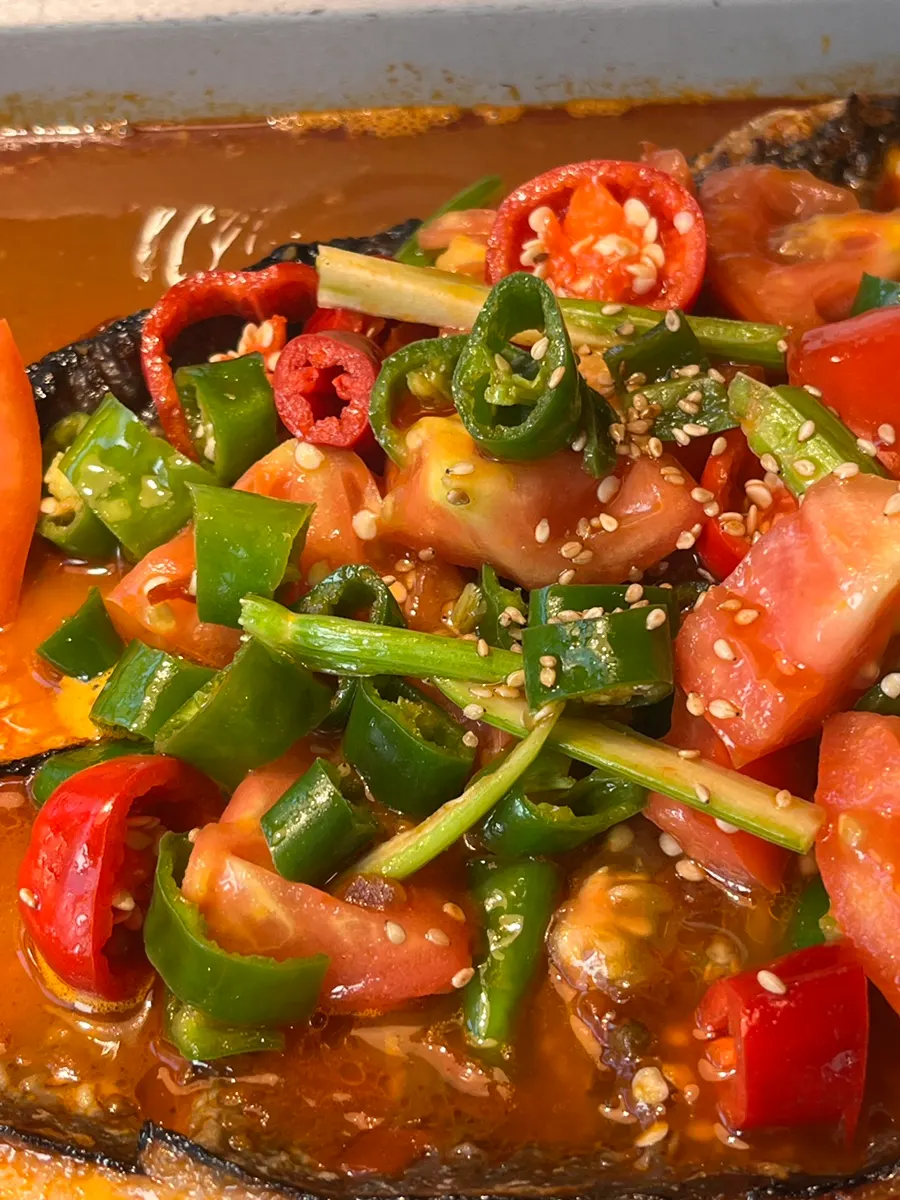 Tomato kaoyu broth loaded with chili peppers