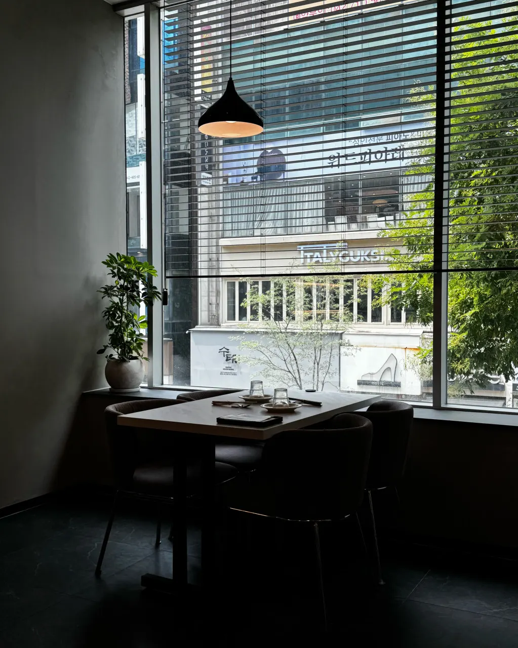 Interior of Plate Dunsan Branch lit with soft lighting