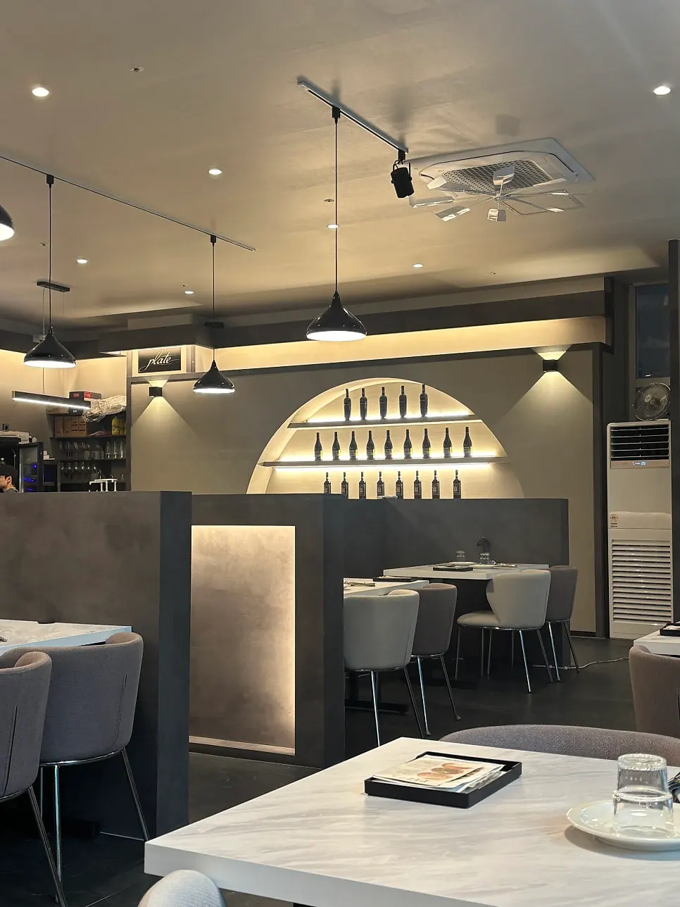 Plate Dunsan Branch interior accented with wine bottles