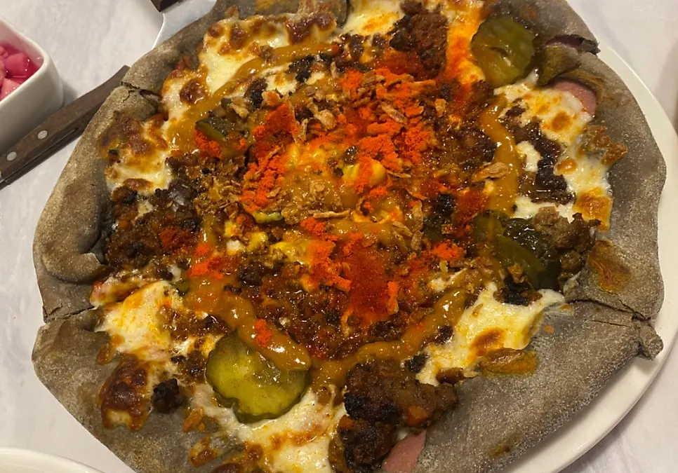 The pizza set beside the pasta