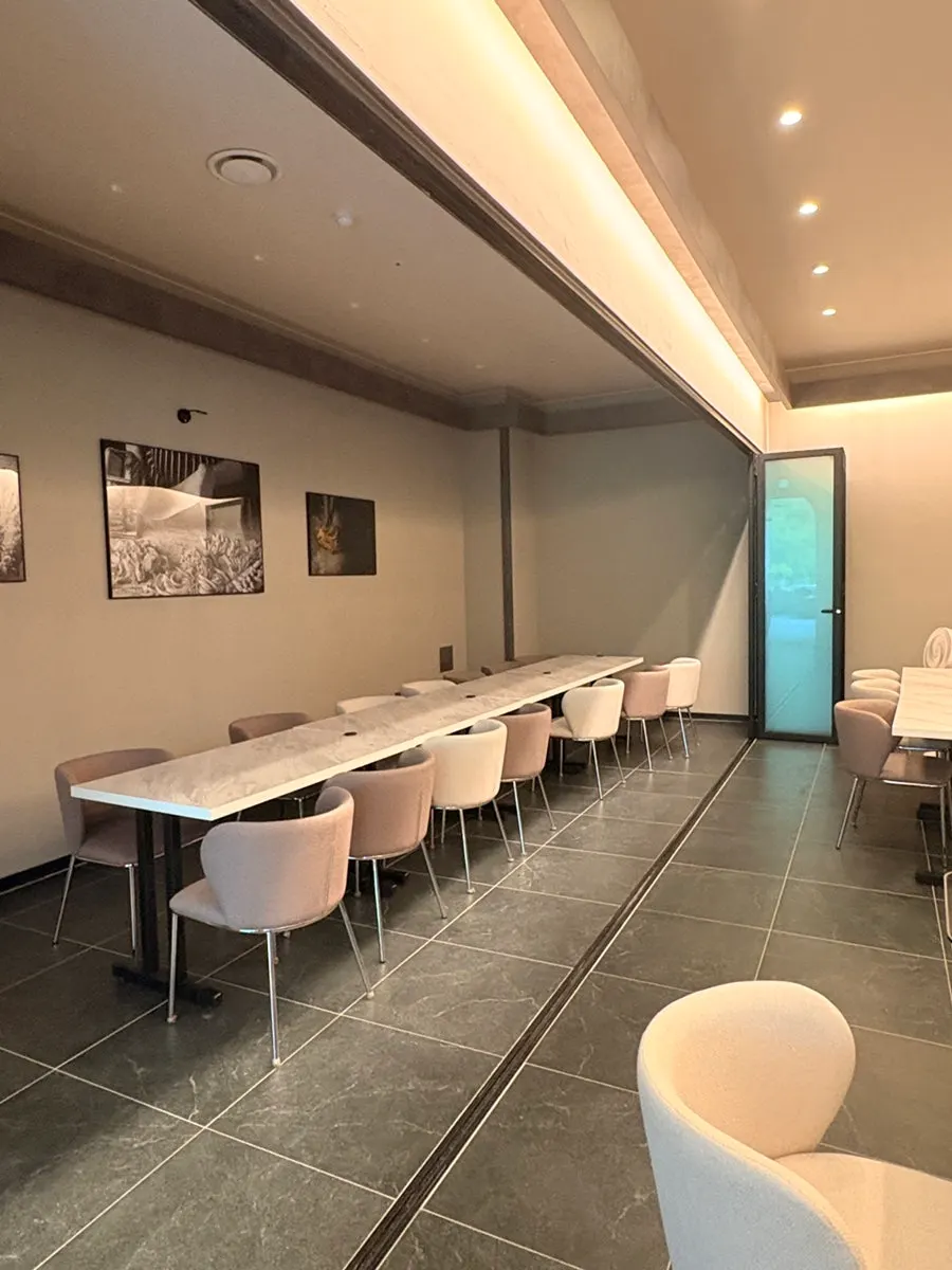 Dining hall with many tables at Plate Dunsan Branch