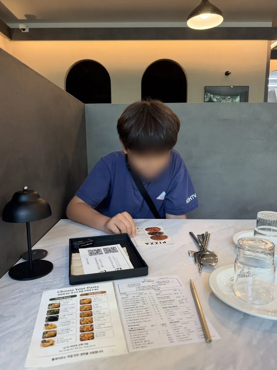 My son choosing the pizza menu