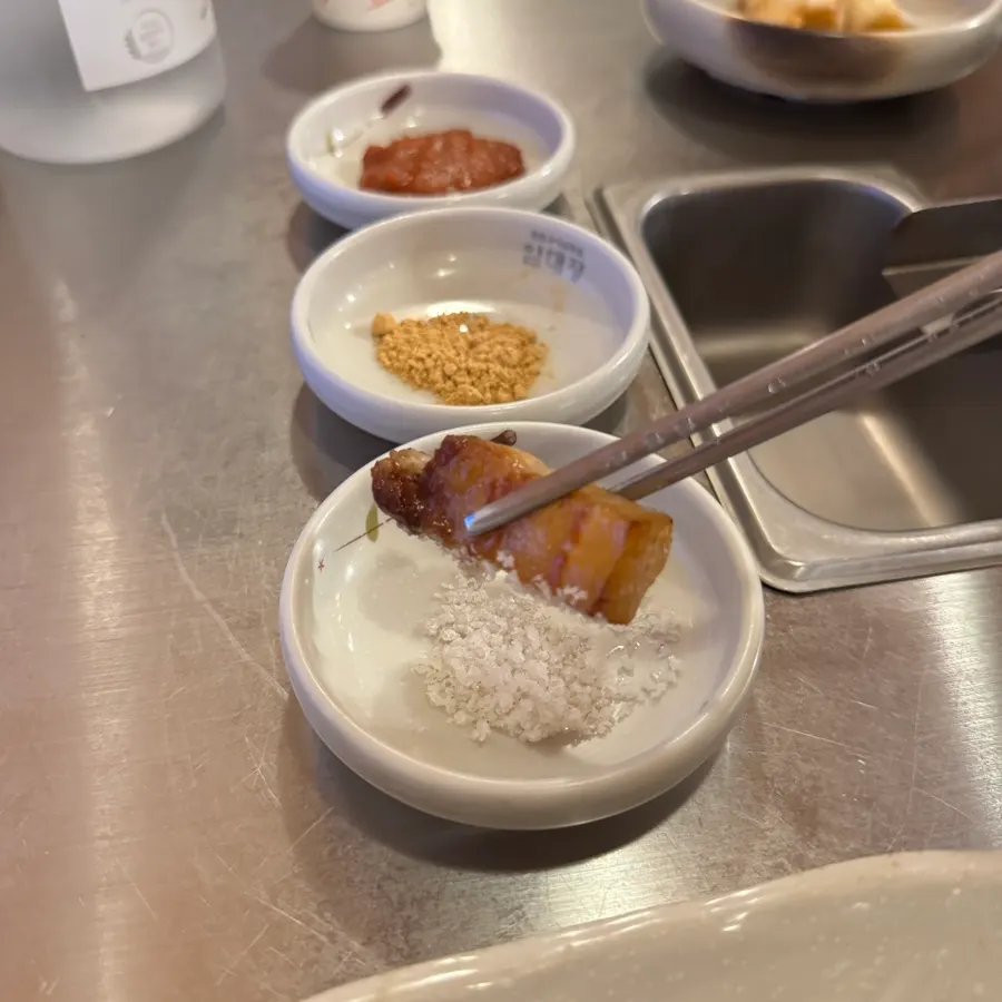 Pork belly held up with chopsticks