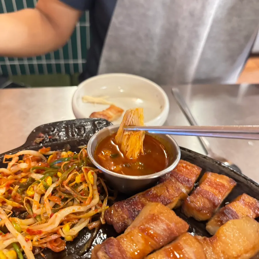 Pork belly dipped in the fire-chicken sauce