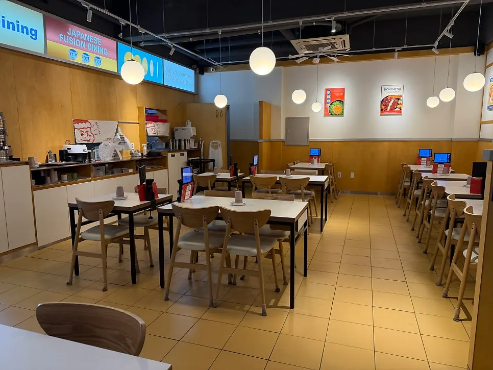 Interior of the restaurant with tables for 2–4 people