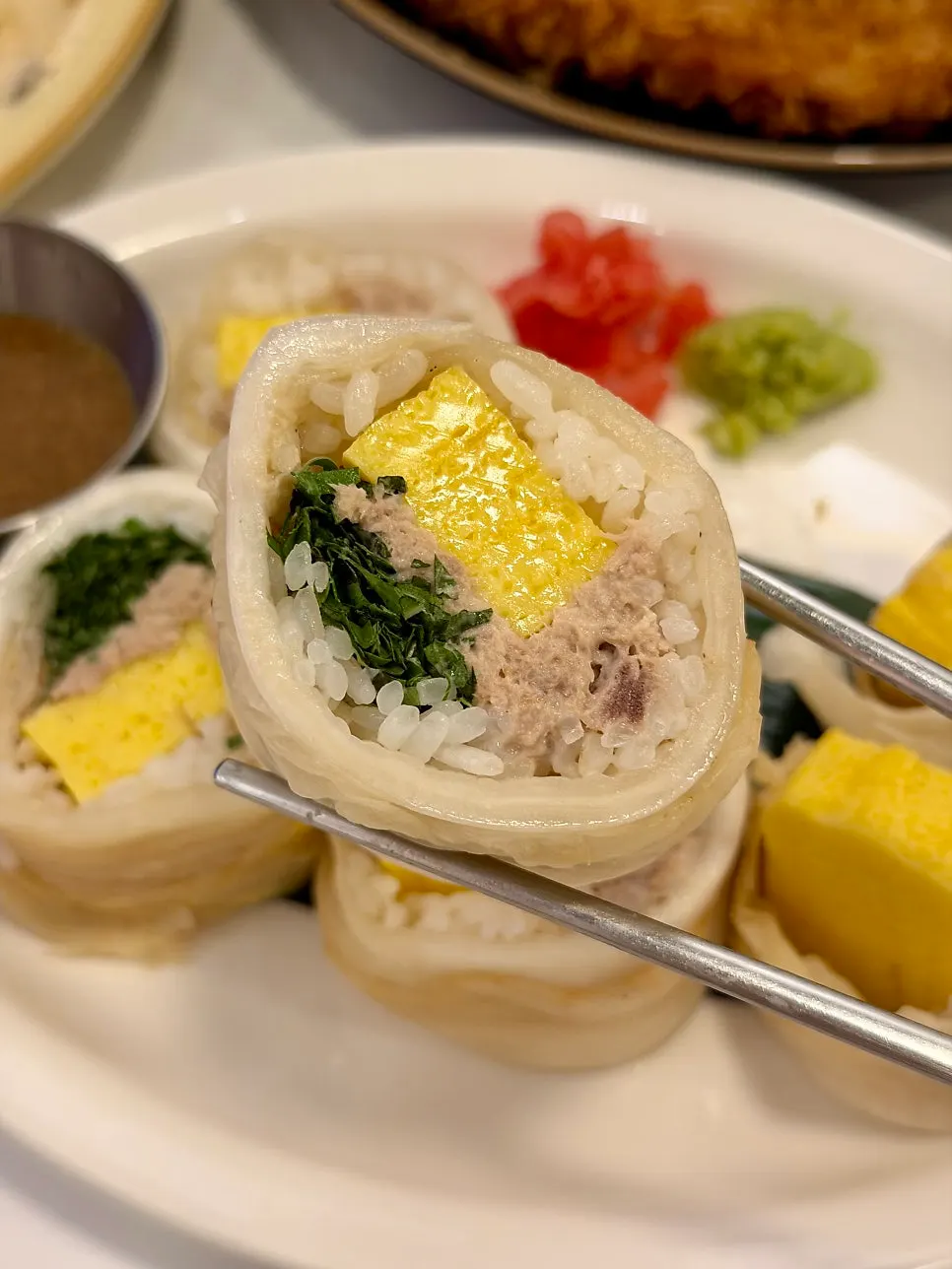 Aged kimchi maki filled with tuna, egg, and perilla leaf