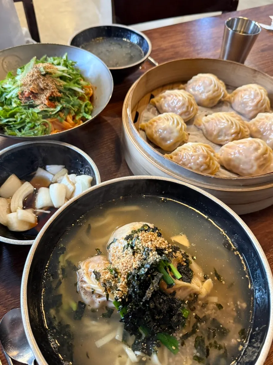 A full spread of kalguksu and dumplings