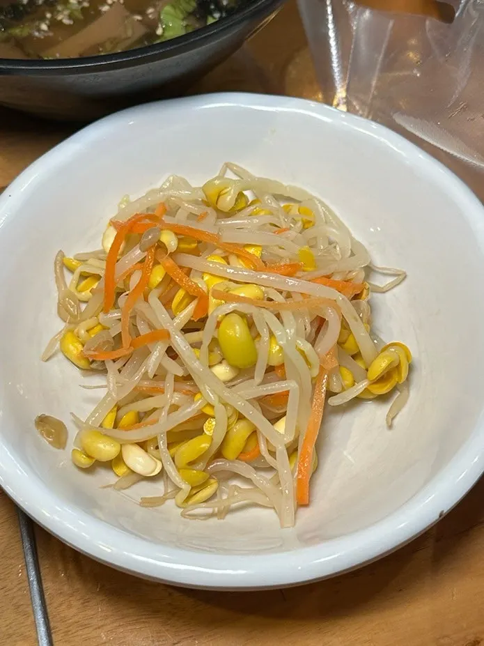 Side dishes including bean sprouts and mukbap jelly noodles