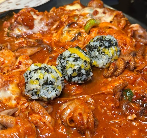 Rice balls coated in octopus sauce