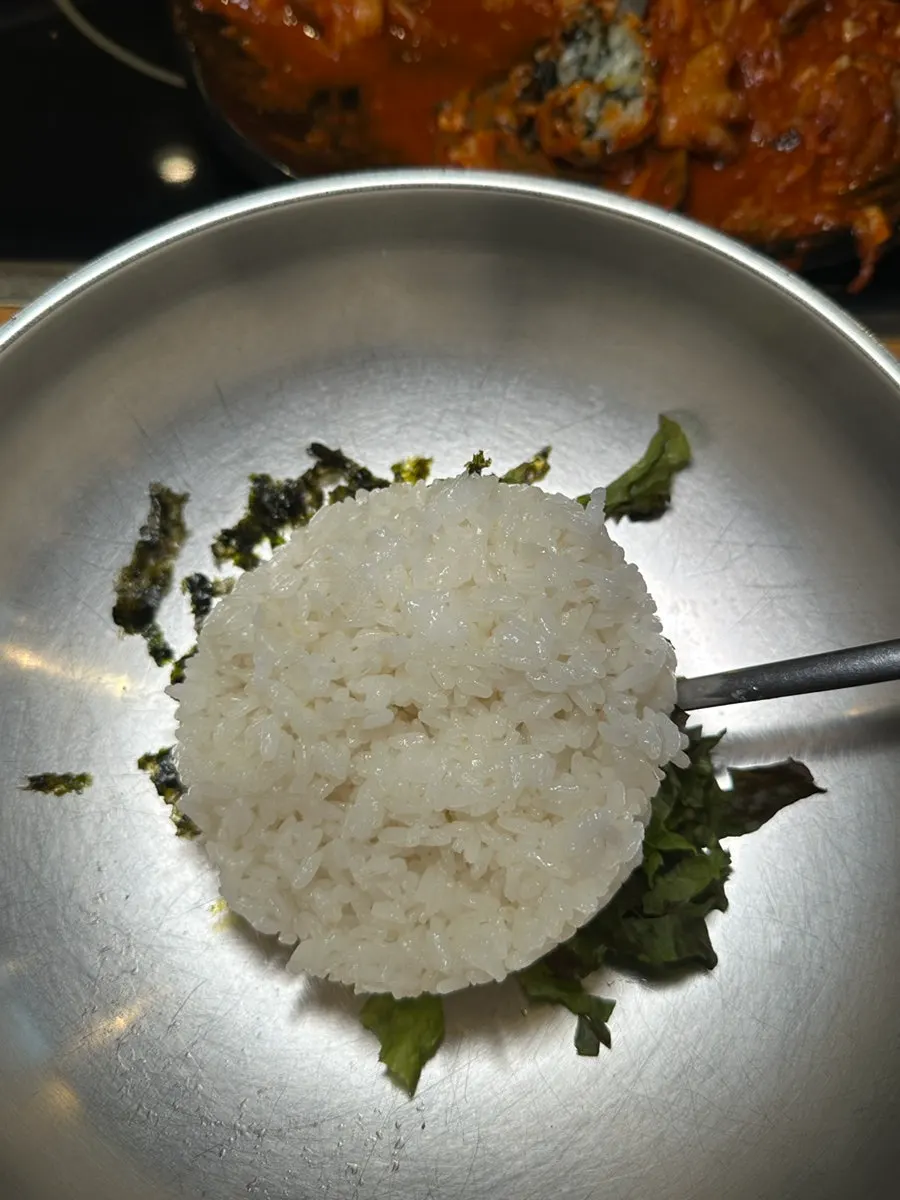 Table with octopus stir-fry and rice balls together