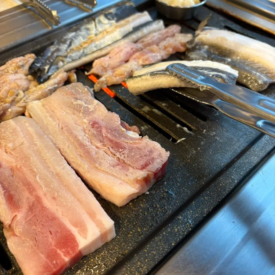 Fresh eel grilling skin-side down first