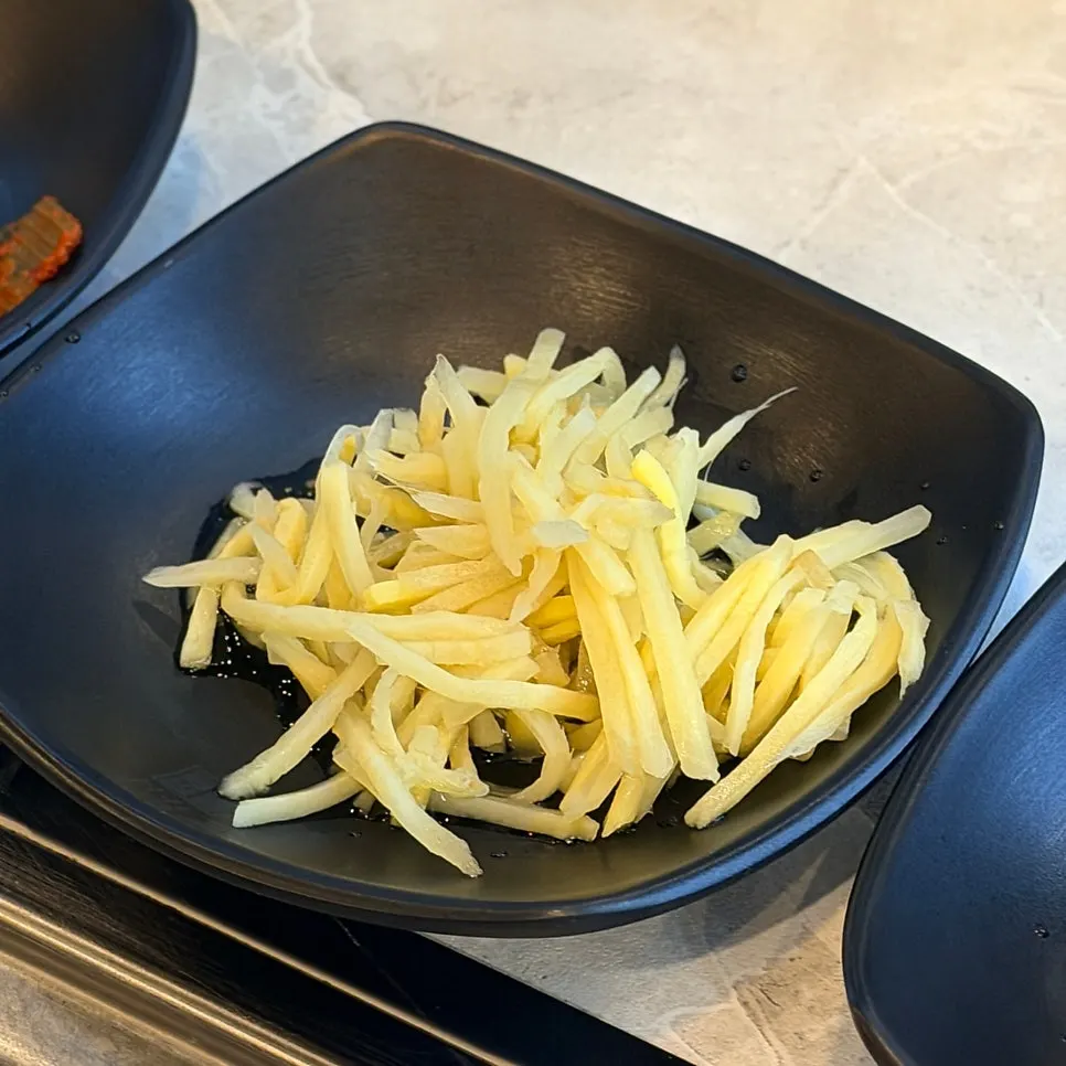 Aged kimchi and ginger served with eel