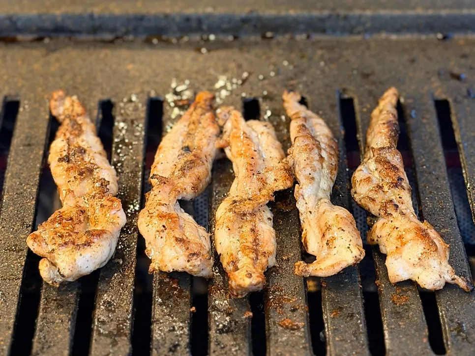 Seasoned chicken neck on the grill