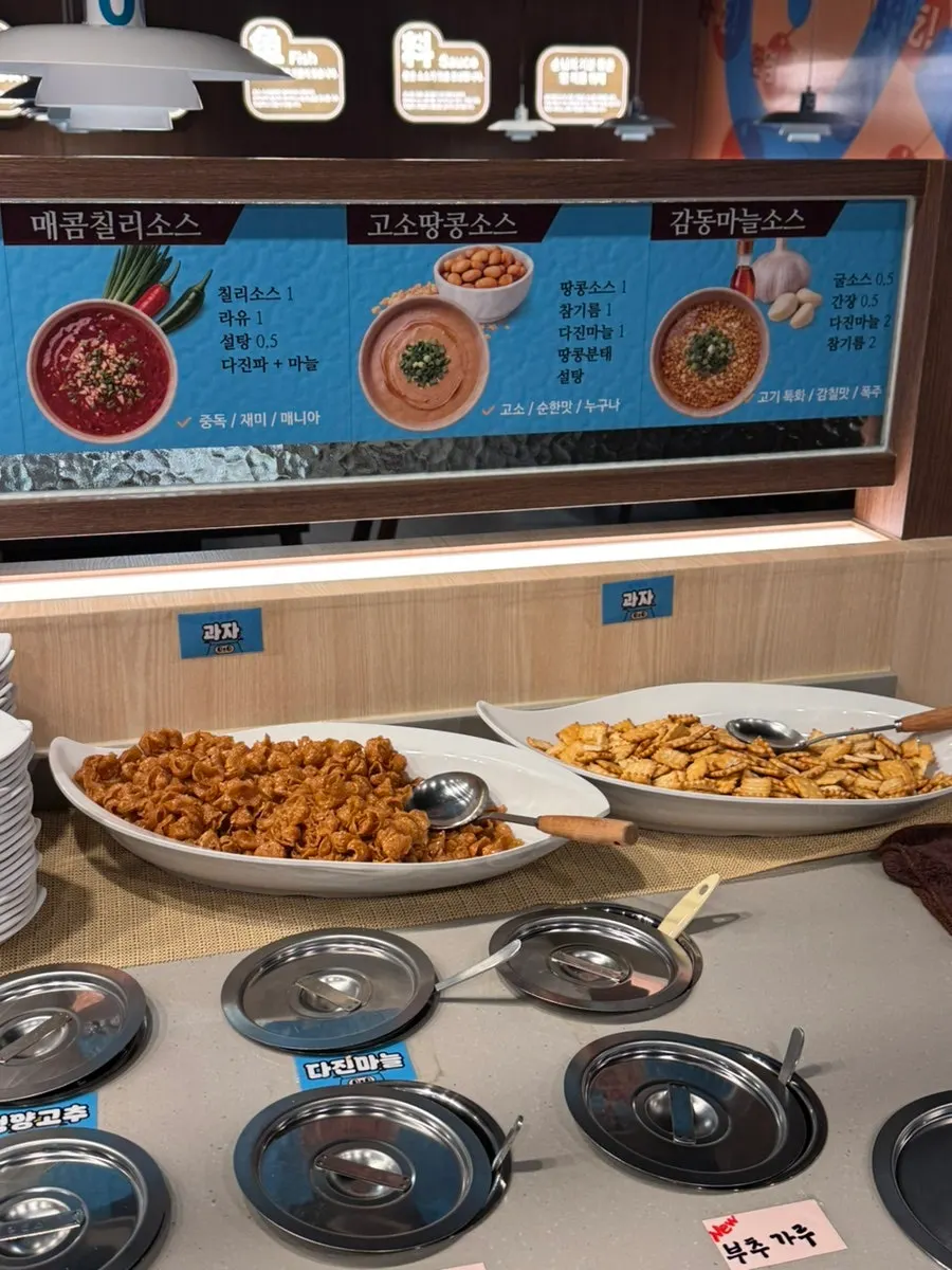 Steamed rice and kaoyu accompaniments from the self-service bar