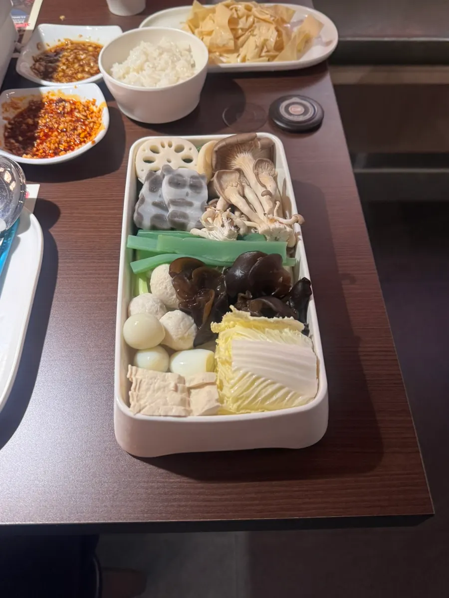 Kaoyu topped with the assorted vegetable and mushroom add-on