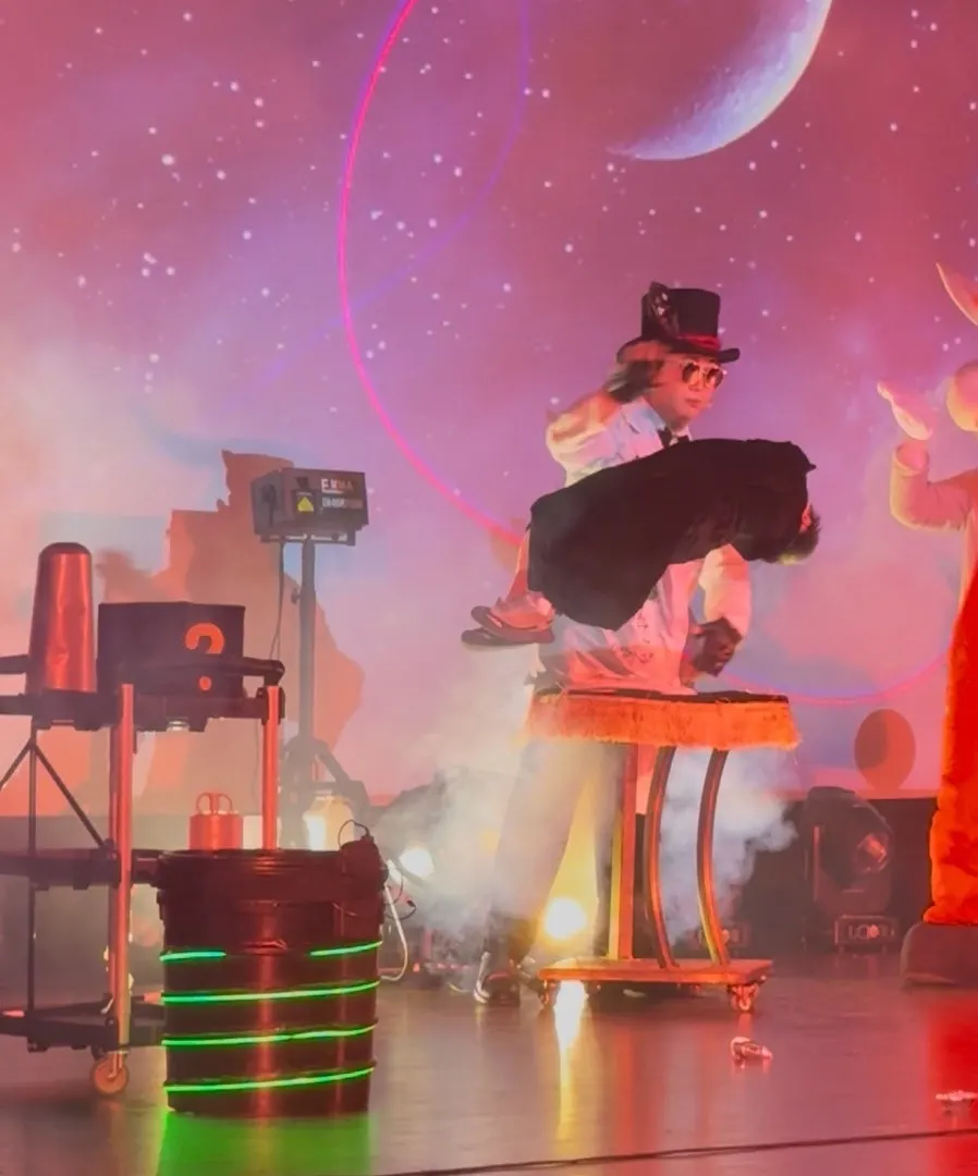 A child on stage during the levitation magic trick