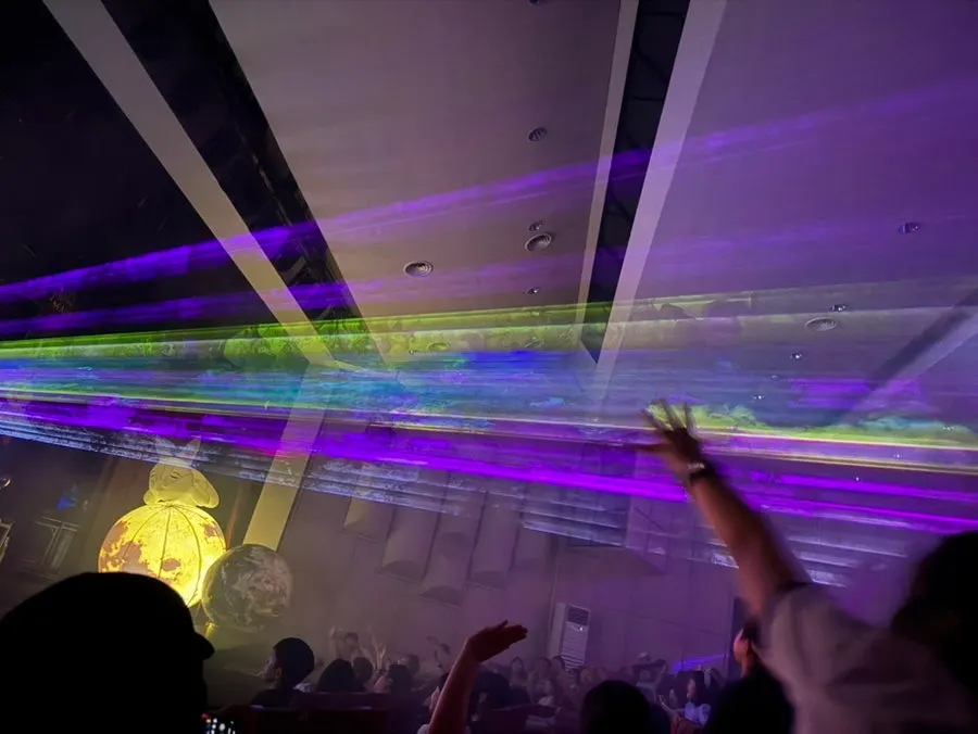 Laser lights sweeping over the audience