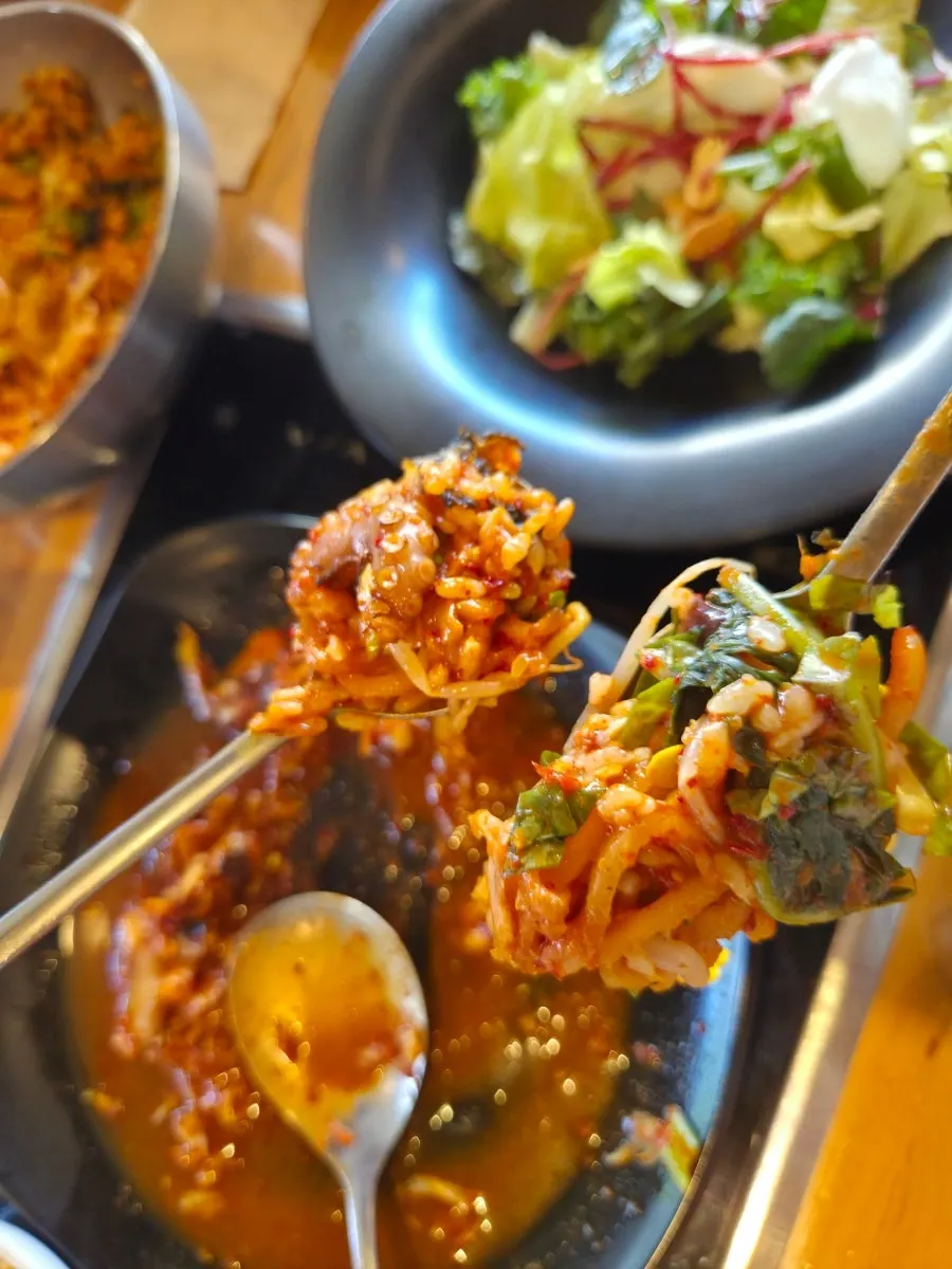 A spoonful piled high with octopus