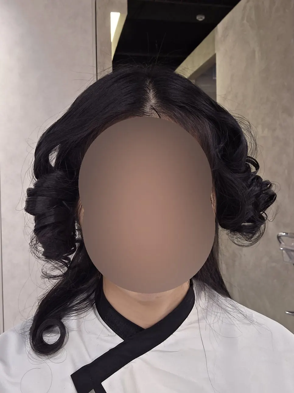 Smoothing semi-wavy sections with a flat iron