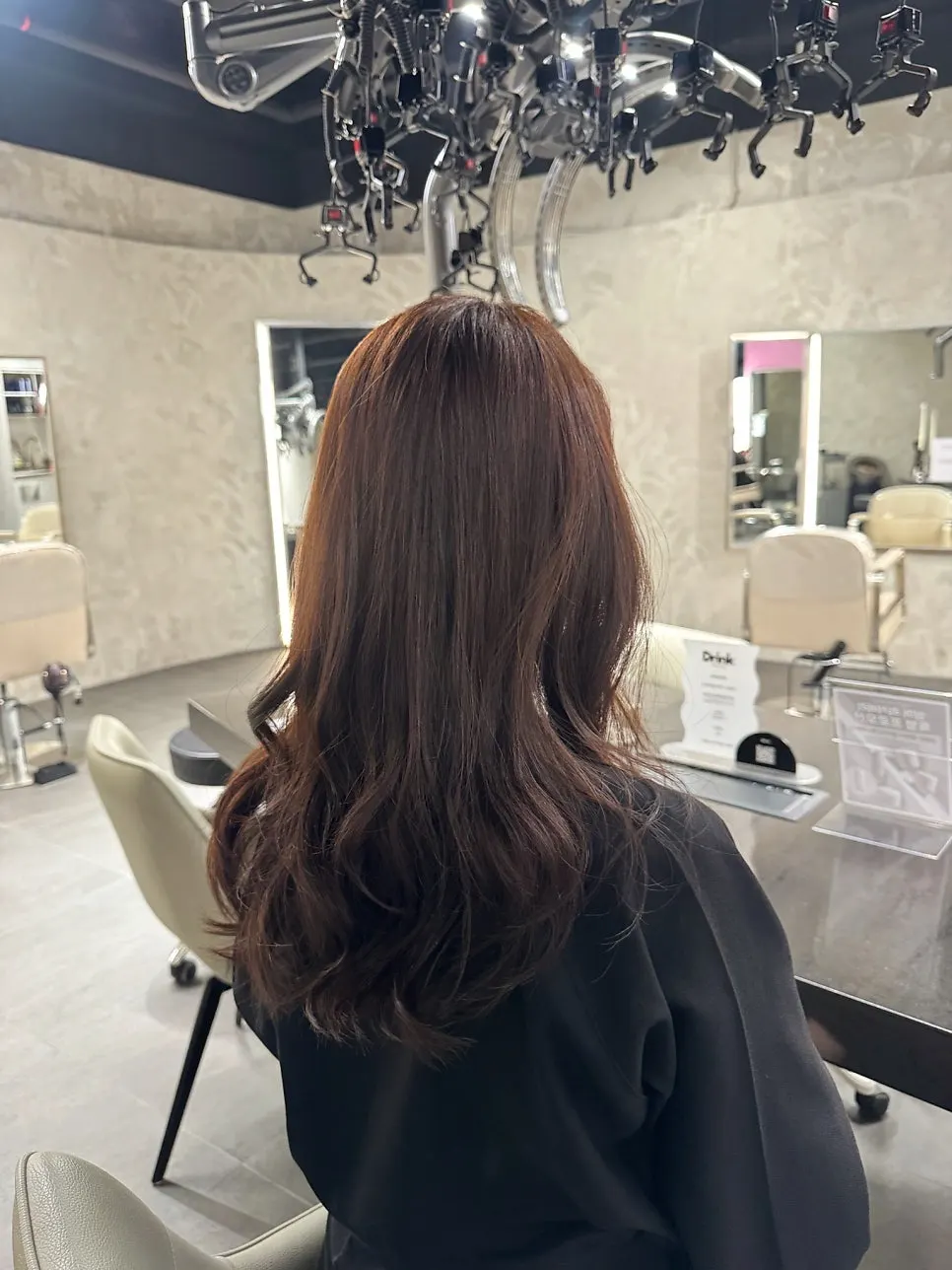 Bright brown hair finished with a curling iron