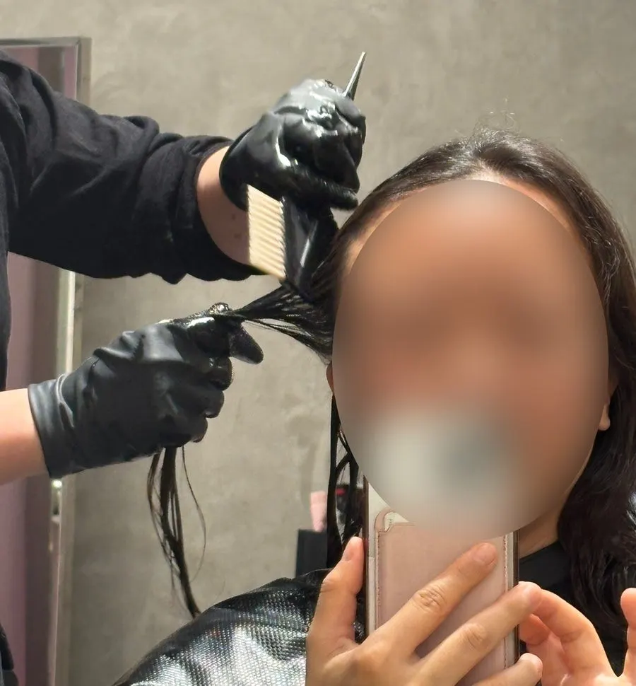 Winding long hair for the S-curl perm