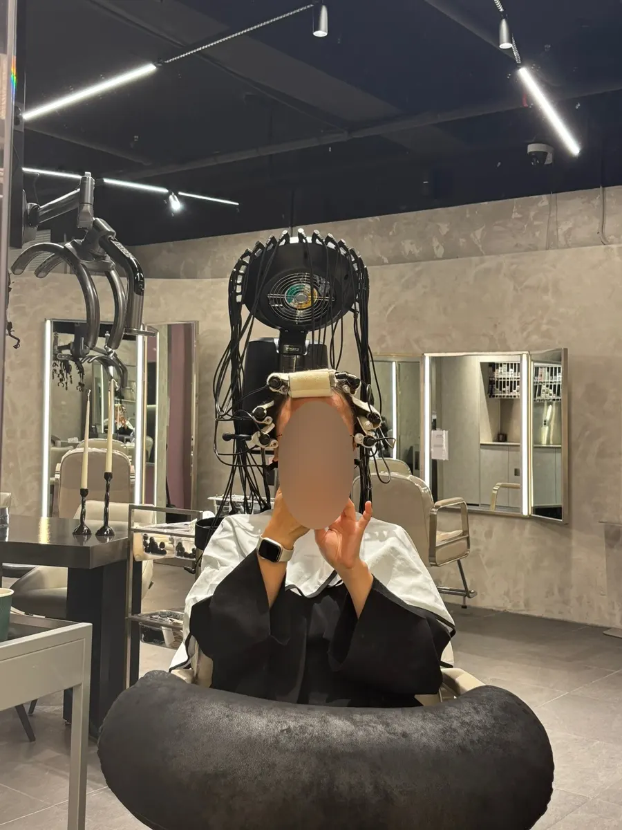 Applying a solution blended for the hair's damage level