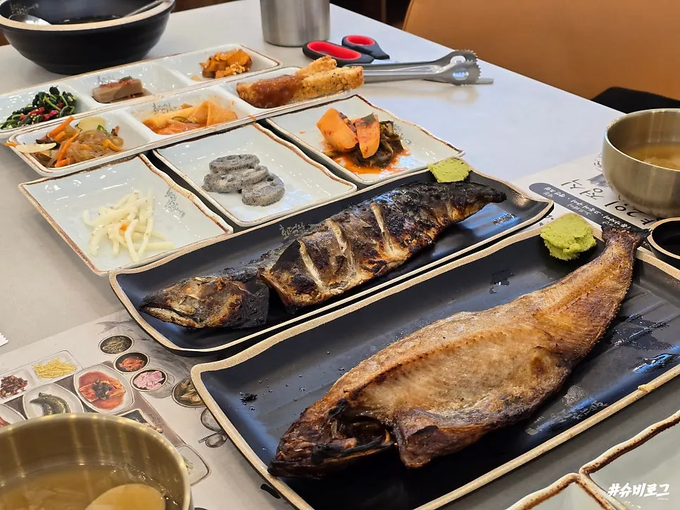 Full meal with basic side dishes and grilled fish