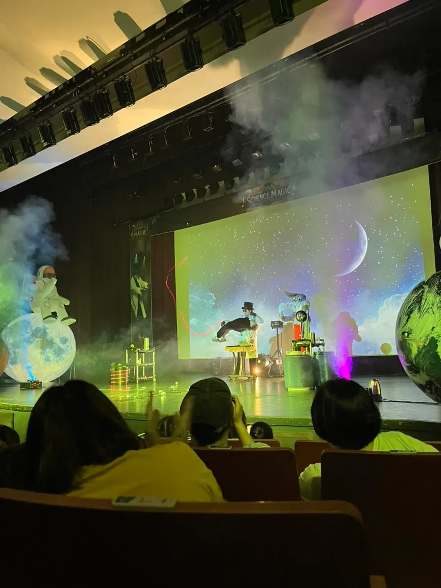 A scene of questions and answers onstage